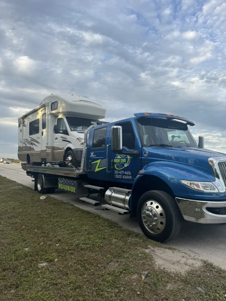 high end towing truck towing a van